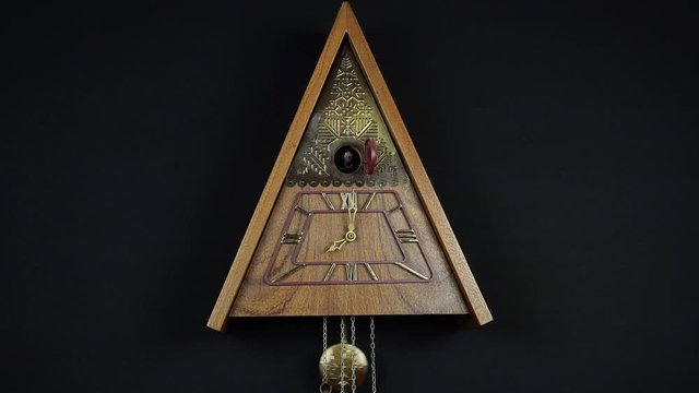 Old Mechanical Clock With A Cuckoo On A White Background.