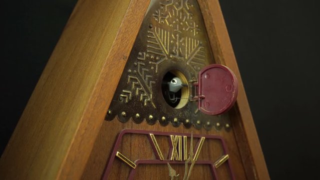 Old Mechanical Clock With A Cuckoo On A White Background.