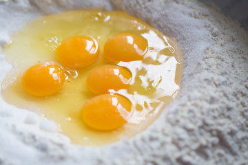 Preparation of Easter cake, also called Pastiera Napoli, typical homemade dessert, with eggs, flour, sugar and vanilla, wheat and colored sugared almonds