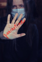 concept of epidemic and quarantine/masked woman sad locked indoor