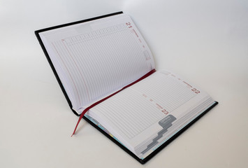 Black leather notebook on white background