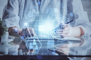 Social network theme hologram over woman's hands writing background. Concept of international people connect. Double exposure