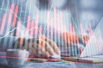 Double exposure of forex graph with man working on computer on background. Concept of market analysis.