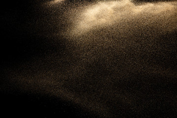 Brown colored sand splash.Dry river sand explosion isolated on black background. Abstract sand cloud. - obrazy, fototapety, plakaty
