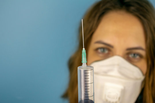 Soothing image of a doctor with a syringe in the treatment of a viral disease.