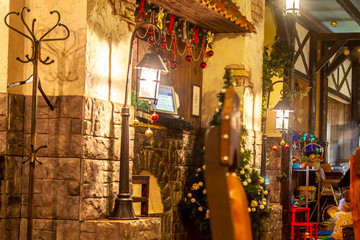 Obraz na płótnie Canvas Christmas atmosphere in the restaurant, cafe. Decorations, Christmas tree.