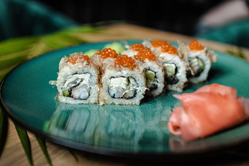 japanese sushi food. Maki ands rolls with tuna, salmon, shrimp, crab and avocado. Top view of sushi.