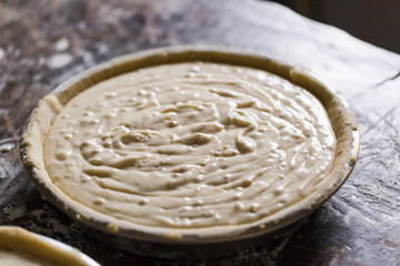 Preparation of Easter cake, also called Pastiera Napoli, typical homemade dessert, with eggs, flour, sugar and vanilla, wheat and colored sugared almonds