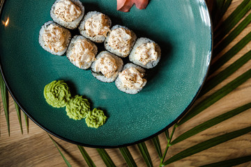japanese sushi food. Maki ands rolls with tuna, salmon, shrimp, crab and avocado. Top view of sushi.