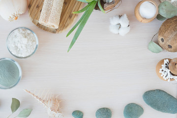  natural antisepti concept with spa setting. composition with Dead sea salt, coconut,  natural cosmetic blue clay,  soda, loofah. Flat lay, Spa concept with cotton flower, stones and towel. Copy space