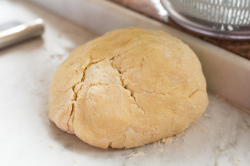 Preparation of Easter cake, also called Pastiera Napoli, typical homemade dessert, with eggs, flour, sugar and vanilla, wheat and colored sugared almonds