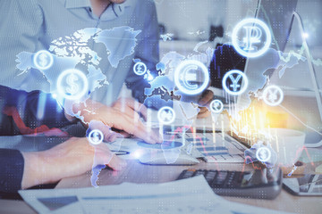 Multi exposure of chart with man typing on computer in office on background. Concept of hard work.