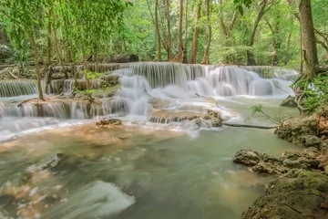 Poster de jardin Cascades Beautiful soft silky white water flowing on arch rock with green forest background, Huay Mae Khamin Waterfall floor 6th (Dong Pee Sua) Kanchanaburi, west of Thailand.  © Yuttana Joe