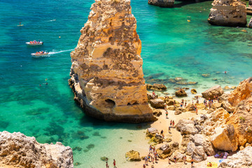 Sunny day at the Portugal beach during summer holiday