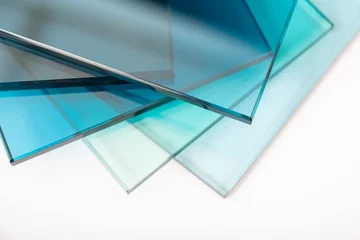 Deurstickers Sheets of Factory manufacturing tempered clear float glass panels cut to size © tutye