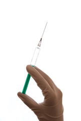 Hand with sterile glove holding syringe with vaccine against coronavirus covid-19 SARS-CoV-2