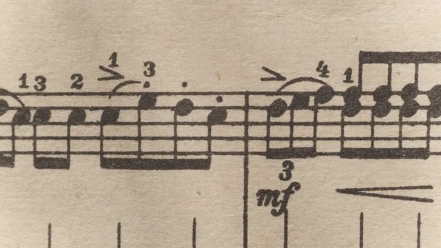 camera moves above a notebook with notes, close up, macro view, slider moving