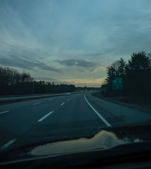 Perspective of highway at dusk - Maine turnpike.