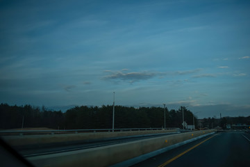 Perspective of highway at dusk - Maine turnpike.