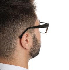 Fototapeta premium Young businessman with glasses on white background, closeup