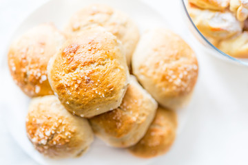 Fresh salty bread buns pastry topped with salt