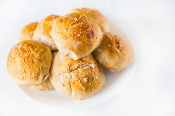Fresh salty bread buns pastry topped with salt
