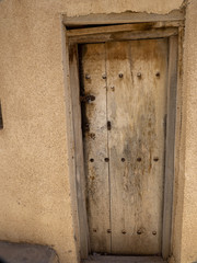 Wooden door of old houses, hamlet in mountains, Oman