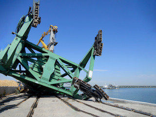 Harbor Crane collapse. Fallen port crane after a strong storm. A large-capacity harbor crane lies...