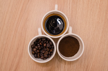 Three types of coffee - ground, grain, beverage 