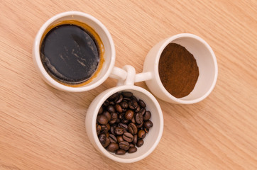 Three types of coffee - ground, grain, beverage 