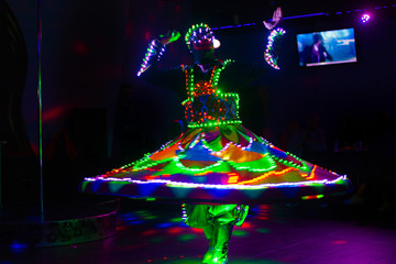 Dance of the Egyptian dervishes Tanura show. Light texture, blur background for design.