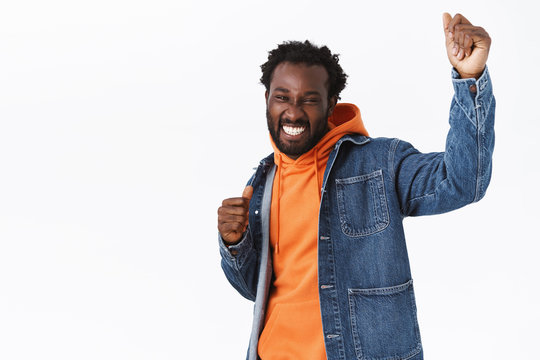 Cheerful, Carefree And Relaxed Handsome Stylish African-american Guy Having Fun, Dancing And Partying Enjoy Spooky Halloween Holiday, Raising Hands Up Delighted, Smiling, Stand White Background