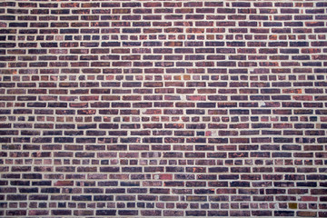 Brick wall fragment of an old building in New York City under natural light. Close-up. Texture. Background.