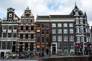 Fototapeta na wymiar Cityscape of Amsterdam. Dutch city architecture. Modern exterior of buildings. Travel to Europe.