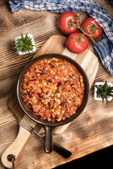 Chili con carne in a clay pan.