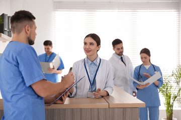 View of modern clinic with working doctors