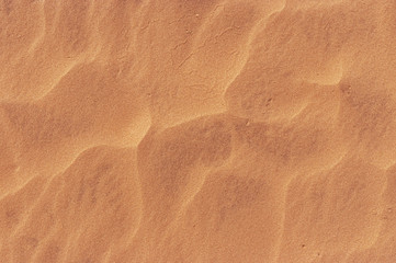 Fototapeta na wymiar Waves of sand pattern in hot desert - aerial view