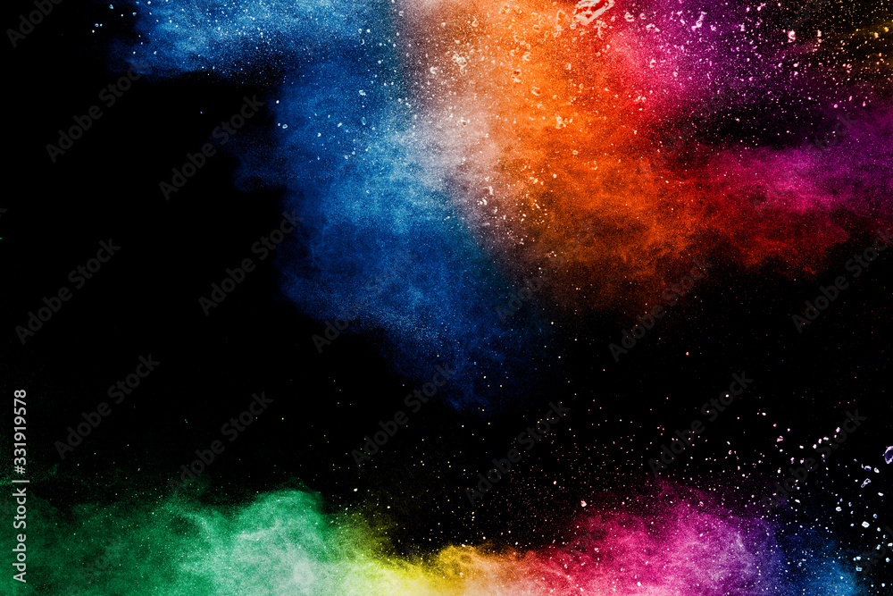 Wall mural colorful background of pastel powder explosion.rainbow color dust splash on black background.