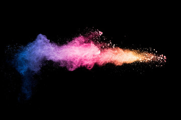 Colorful background of pastel powder explosion.Rainbow color dust splash on black background. - obrazy, fototapety, plakaty