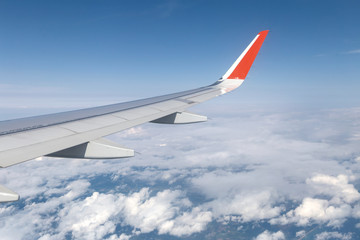 Fototapeta na wymiar Looking through window aircraft during flight in wing