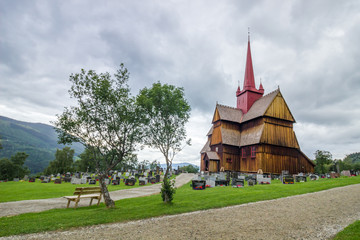Fototapeta na wymiar wooden church and cemetery in Ringebu in Norway