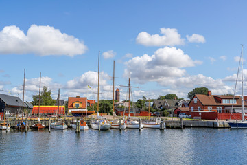 Fototapeta na wymiar Raa, Sweden - 21 August, 2019: Old and modern boats standing in marina. Raa - old fishing village located in southern Sweden, Helsingborg
