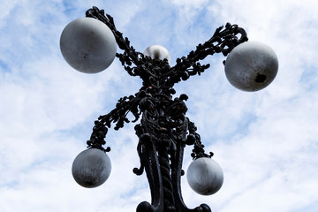 Fototapeta na wymiar Stradal chandelier. Beautiful street lamp like a chandelier with a baroque style.