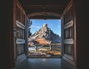 Fantastic view over Giau Pass from interior of famous wooden chalet. Open doors and beautiful view...