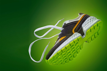 sports shoes, sports sneakers on a green background with a place for the inscription, Copy-space