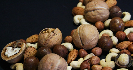 Nuts in bowl on white background, top view with copyspace.  Assorted mixed nuts  isolated on table.