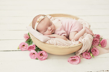 Fototapeta na wymiar Sleeping newborn baby. Healthy and medical concept. Healthy child, concept of hospital and happy motherhood. Infant baby. Happy pregnancy and childbirth. Children's theme. Baby and childen's goods