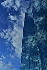 Plakat glass facade reflected in the clouds