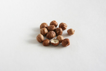 Hazelnuts  on white background, top view with copyspace.  