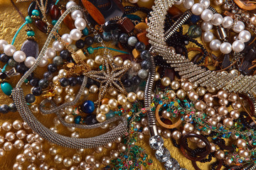 Various jewelry on a gold background